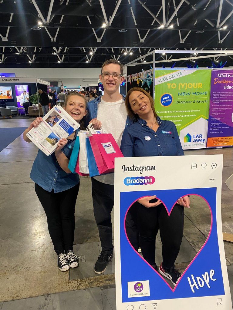 2 female and 1 male Bradannii Staff member at a trade show